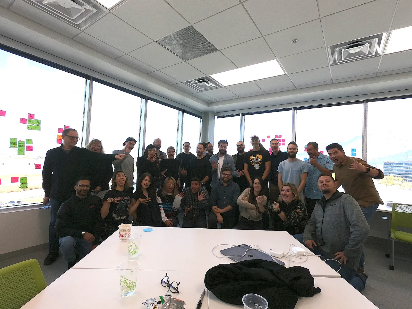 Designers, managers, directors, and the VP of UX celebrating the newly established design principles